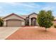 Charming single-story home with desert landscaping, inviting entrance, and two car garage at 2319 E San Tan Dr, Gilbert, AZ 85296