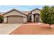 Inviting exterior of a single-story home with neutral stucco and a well-maintained front yard at 2319 E San Tan Dr, Gilbert, AZ 85296