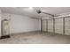 Spacious garage with large doors and ample room for storage or parking at 2319 E San Tan Dr, Gilbert, AZ 85296