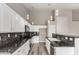 Well-equipped kitchen with ample cabinet space, granite countertops, and a stylish breakfast bar at 2319 E San Tan Dr, Gilbert, AZ 85296