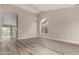 Spacious living room with vaulted ceilings, a chandelier, and plank flooring at 2319 E San Tan Dr, Gilbert, AZ 85296