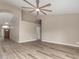 Spacious living room featuring stylish wood flooring and a modern ceiling fan at 2319 E San Tan Dr, Gilbert, AZ 85296