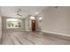 Open living area with hardwood floors, large windows, and vaulted ceiling at 2319 E San Tan Dr, Gilbert, AZ 85296