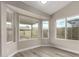 Cozy sunroom with abundant natural light streaming through multiple windows at 2319 E San Tan Dr, Gilbert, AZ 85296