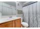 Neat bathroom featuring a single sink vanity with storage and a shower with simple curtain at 2402 E 5Th St # 1532, Tempe, AZ 85288