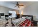 Comfortable bedroom with ample desk space, ceiling fan, and neutral decor for a relaxing atmosphere at 2402 E 5Th St # 1532, Tempe, AZ 85288