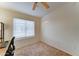 Bright bedroom featuring plush carpet, ceiling fan and natural light from the window at 2402 E 5Th St # 1532, Tempe, AZ 85288