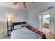 Cozy bedroom with a plush bed, ceiling fan, and easy access to the en-suite bathroom at 2402 E 5Th St # 1532, Tempe, AZ 85288