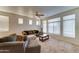 Living room featuring bright windows, a ceiling fan, and comfortable furniture at 2402 E 5Th St # 1532, Tempe, AZ 85288