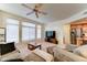 Bright living room showcasing a large window, cozy seating, and seamless flow to the kitchen at 2402 E 5Th St # 1532, Tempe, AZ 85288