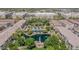 Panoramic aerial view of a community's lush landscaping, featuring a pool and pond for outdoor enjoyment and relaxation at 2658 S Sulley Dr # 102, Gilbert, AZ 85295
