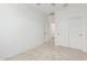 Bedroom featuring neutral carpet, ceiling fan, and walk-in closet at 2658 S Sulley Dr # 102, Gilbert, AZ 85295