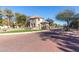 Community entrance with fountain, stone pillars and a beautifully landscaped median at 2658 S Sulley Dr # 102, Gilbert, AZ 85295