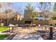 Community fireplace with tables and chairs for residents' enjoyment at 2658 S Sulley Dr # 102, Gilbert, AZ 85295