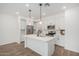 Modern kitchen with white cabinets, stainless steel appliances, and a large center island with sink at 2658 S Sulley Dr # 102, Gilbert, AZ 85295