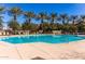 Outdoor community pool with crystal-clear water and surrounding lounge chairs ready for relaxation and enjoyment under the sun at 2658 S Sulley Dr # 102, Gilbert, AZ 85295