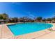 Resort style pool with lounge chairs, covered gazebos, and meticulously kept grounds offering an inviting outdoor oasis at 2658 S Sulley Dr # 102, Gilbert, AZ 85295