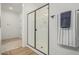 An open shower is encased with glass and includes matte black hardware at 2658 S Sulley Dr # 102, Gilbert, AZ 85295