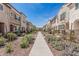 Landscaped street view with townhome-style residences and desert landscaping at 2658 S Sulley Dr # 102, Gilbert, AZ 85295