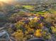 Aerial view of a luxury home with a private pool and easy access to a nearby golf course at 26796 N 98Th Way, Scottsdale, AZ 85262