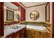A traditional bathroom with a soaking tub, custom vanity, and decorative tile at 26796 N 98Th Way, Scottsdale, AZ 85262