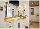 Luxurious bathroom features a custom vanity with onyx countertop and undermount sink at 26796 N 98Th Way, Scottsdale, AZ 85262