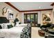 Comfortable bedroom with two beds, access to a balcony, and stylish decor at 26796 N 98Th Way, Scottsdale, AZ 85262