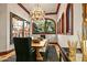 Dining room with chandelier, views of the outdoors from arched windows at 26796 N 98Th Way, Scottsdale, AZ 85262
