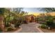 A stunning luxury home with a well-manicured garden, private entrance, and grand architecture at 26796 N 98Th Way, Scottsdale, AZ 85262