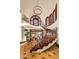Elegant foyer features a grand staircase and open landing with designer windows at 26796 N 98Th Way, Scottsdale, AZ 85262
