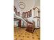Elegant foyer features a grand staircase and open landing with designer windows at 26796 N 98Th Way, Scottsdale, AZ 85262