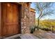 Inviting front entrance with stone accents and a solid wood door at 26796 N 98Th Way, Scottsdale, AZ 85262