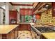Kitchen with island, range, wood cabinets, and views to the backyard at 26796 N 98Th Way, Scottsdale, AZ 85262