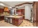 Spacious kitchen featuring custom wood cabinets, island and wine fridge at 26796 N 98Th Way, Scottsdale, AZ 85262