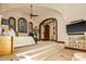 Elevated main bedroom with dark wood trim and natural lighting at 26796 N 98Th Way, Scottsdale, AZ 85262