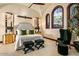 Bright main bedroom featuring dark wood trim and decorative ceiling fan at 26796 N 98Th Way, Scottsdale, AZ 85262