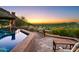 Backyard with swimming pool, city views, luxurious landscape and outdoor seating area with mountain in background at 26796 N 98Th Way, Scottsdale, AZ 85262