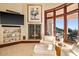Cozy sitting area featuring a fireplace, modern decor, and scenic views at 26796 N 98Th Way, Scottsdale, AZ 85262