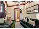 Sitting room with green sofa, desk, and view of shower in ensuite bath at 26796 N 98Th Way, Scottsdale, AZ 85262