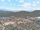 Neighborhood aerial view featuring desert landscape and mountain backdrop at 27420 N 170Th St, Rio Verde, AZ 85263