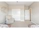 Cozy bedroom featuring a cushioned chair and closet at 27420 N 170Th St, Rio Verde, AZ 85263