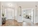 Bright foyer with tile flooring, offers a view into a cozy room with comfortable seating and neutral tones at 27420 N 170Th St, Rio Verde, AZ 85263