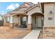 Inviting front porch features a cozy seating area, stone accents, and a well-defined walkway to the entrance at 27420 N 170Th St, Rio Verde, AZ 85263