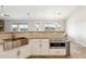Well-appointed kitchen with stainless steel sink, white cabinets, granite countertops, and modern microwave appliance at 27420 N 170Th St, Rio Verde, AZ 85263