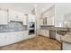 Modern kitchen features white cabinetry, granite countertops, stainless steel appliances, and stylish backsplash at 27420 N 170Th St, Rio Verde, AZ 85263