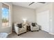 Bright room with seating, a view of the desert landscape, and neutral colors at 27420 N 170Th St, Rio Verde, AZ 85263