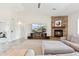 Comfortable living room boasts a stone fireplace, media center, and plush seating, perfect for relaxation at 27420 N 170Th St, Rio Verde, AZ 85263