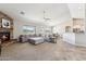 Open living area with a stone fireplace, comfortable seating, and a dining area that offers stunning desert views at 27420 N 170Th St, Rio Verde, AZ 85263