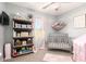 A room with pink accents, window for light, and storage at 30370 N Opal Dr, San Tan Valley, AZ 85143