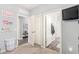 View of well-organized bedroom with open doors leading to other rooms and ample closet space at 30370 N Opal Dr, San Tan Valley, AZ 85143